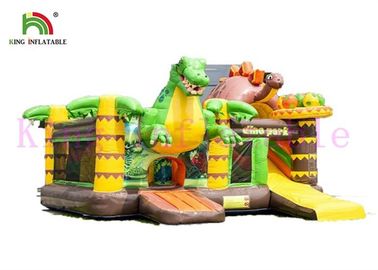 El PVC del tema del dinosaurio explota el castillo animoso con la aventura de la selva de la diapositiva para los niños